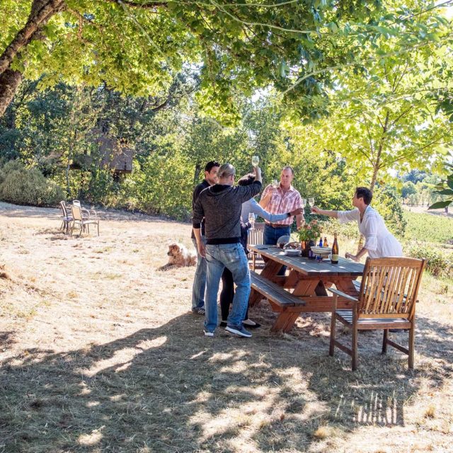 Photo of wine club members enjoying a picnic lunch.
